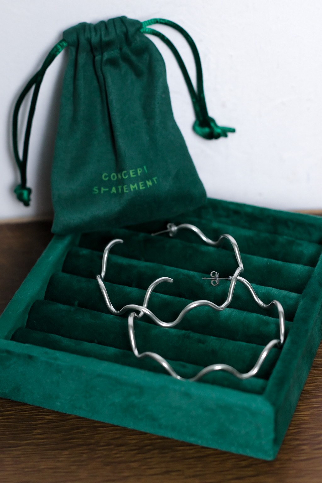 Ola sculptural wave-shaped hoop earrings by Concept Statement