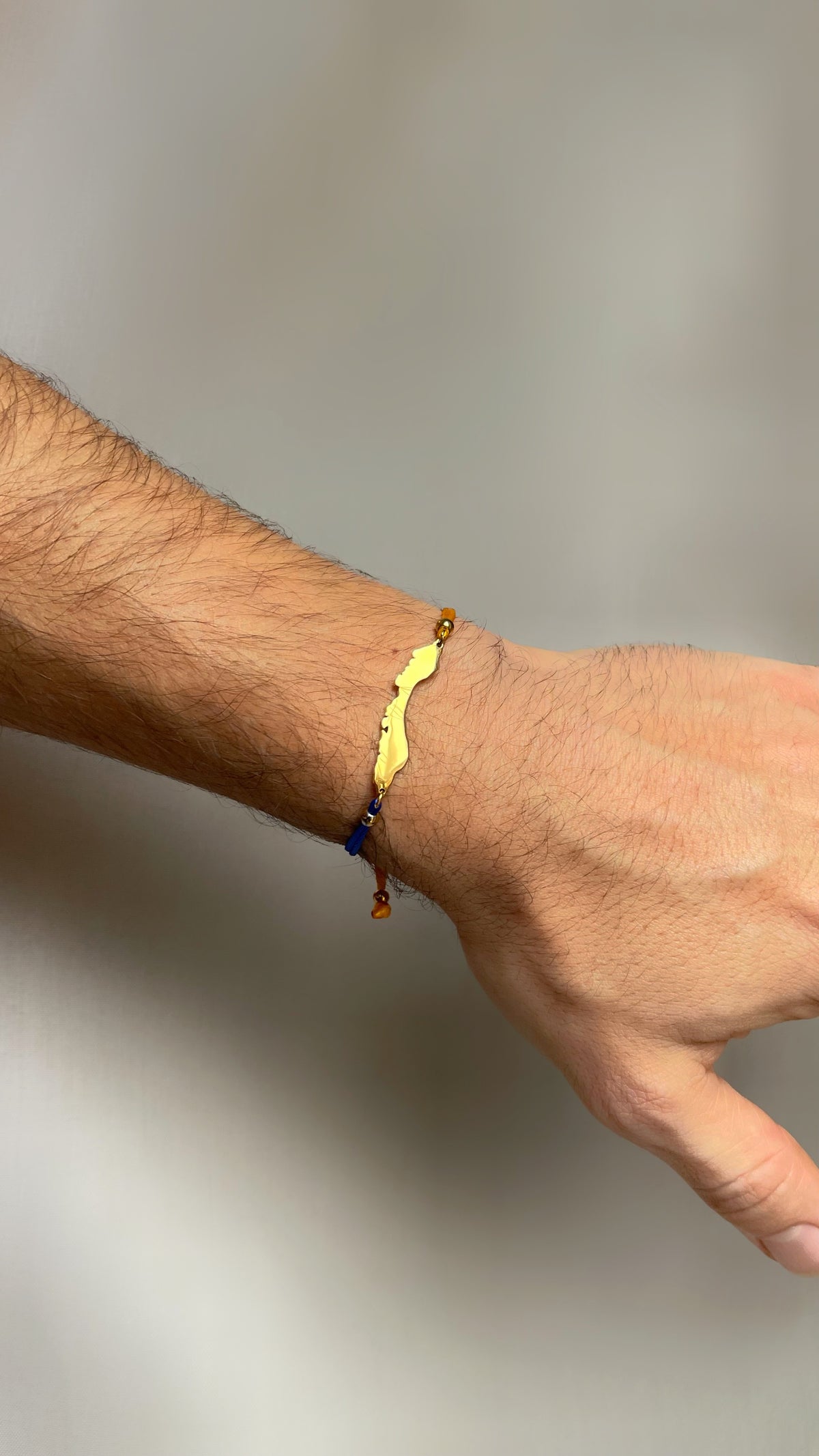 Larger Curaçao island charm on men's flag-colour cord bracelet