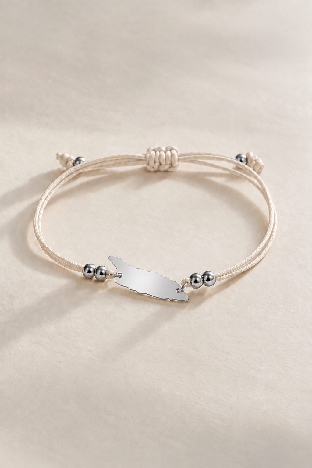 Seashell cream Aruba cord bracelet with silver-tone metal details