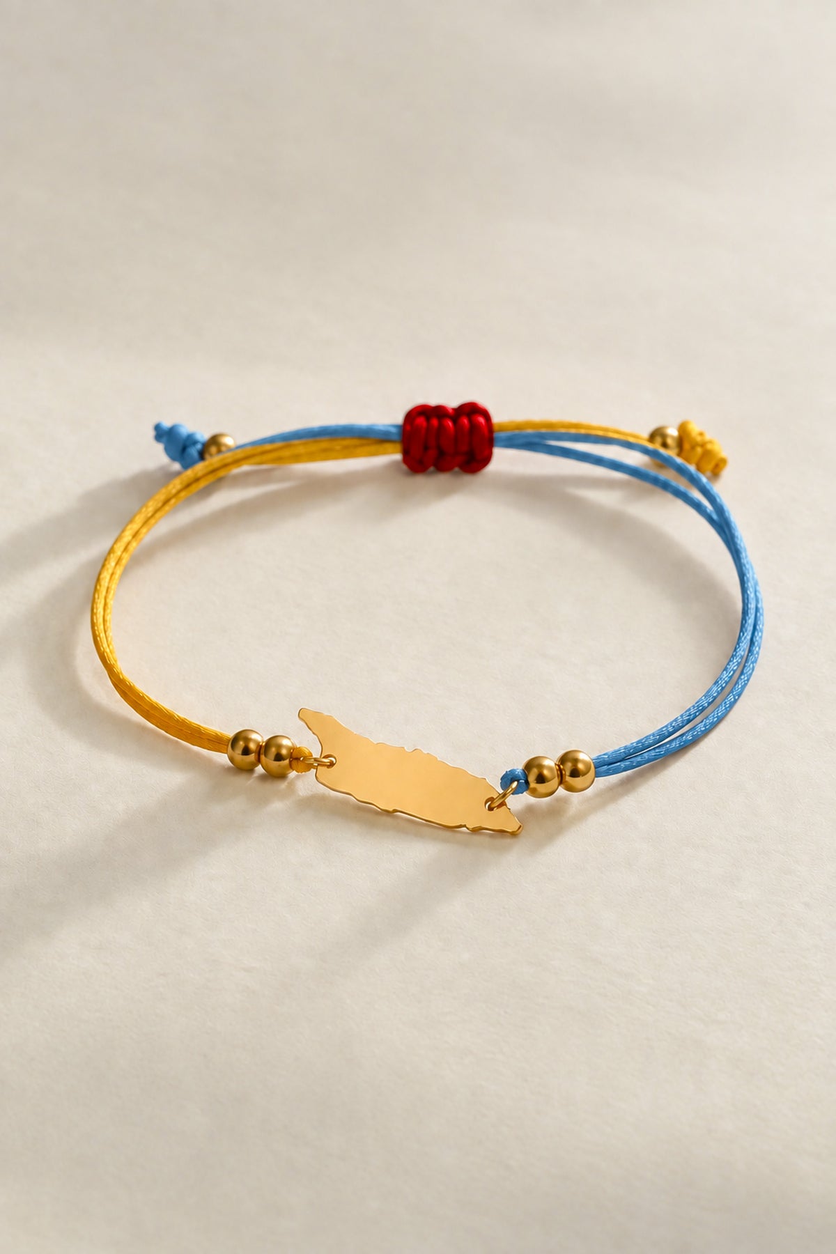 Aruba flag-colour cord bracelet with island-shaped charm