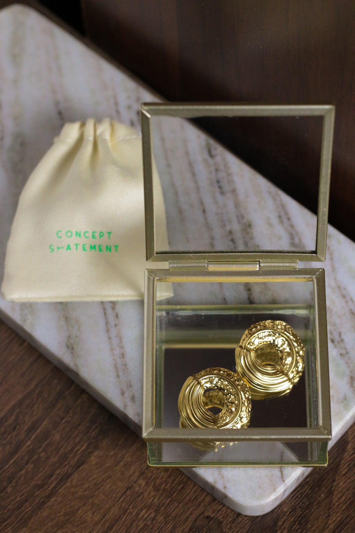 Galaxy carved textured circular earrings by Concept Statement