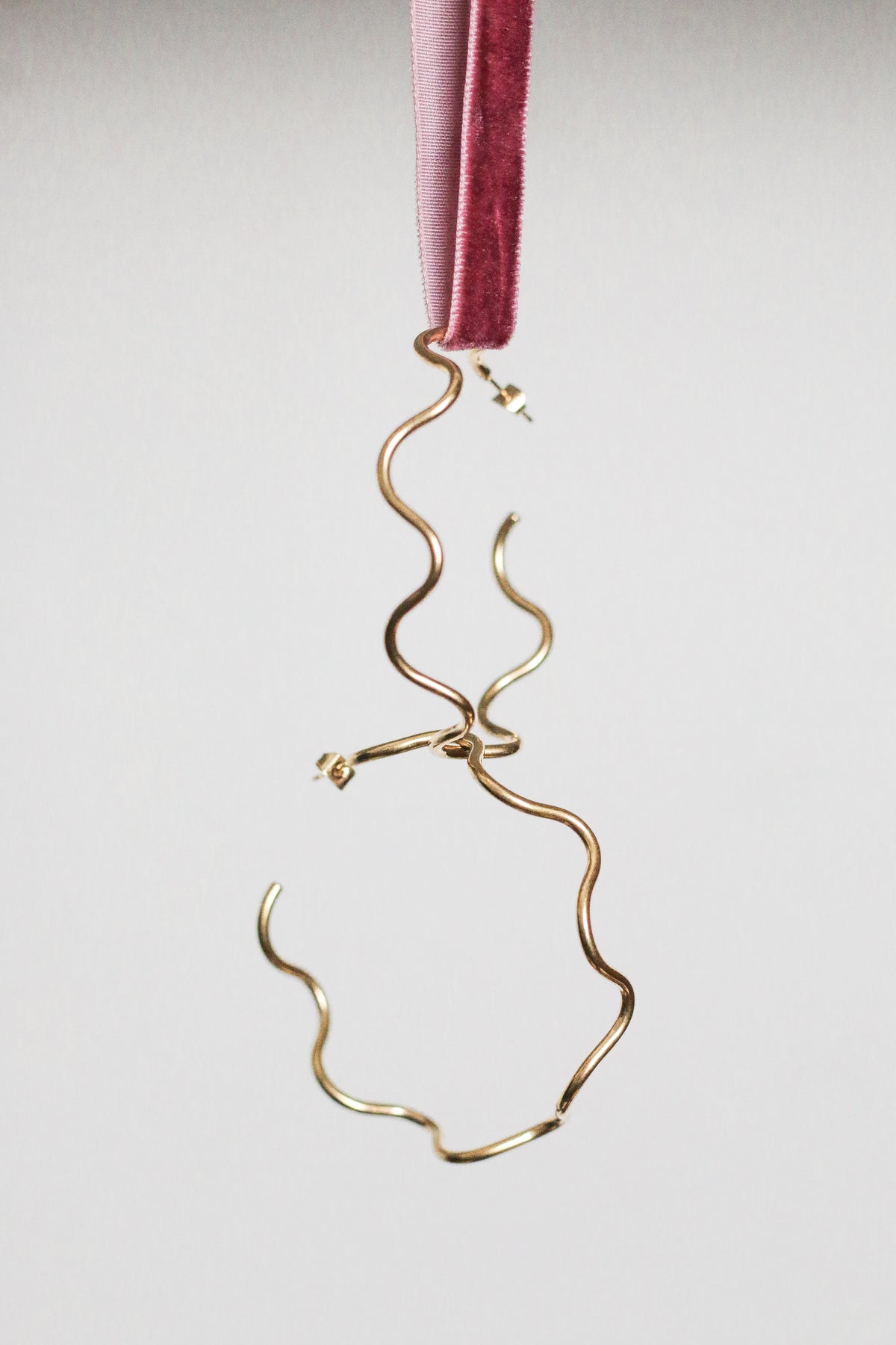 Ola sculptural wave-shaped hoop earrings by Concept Statement