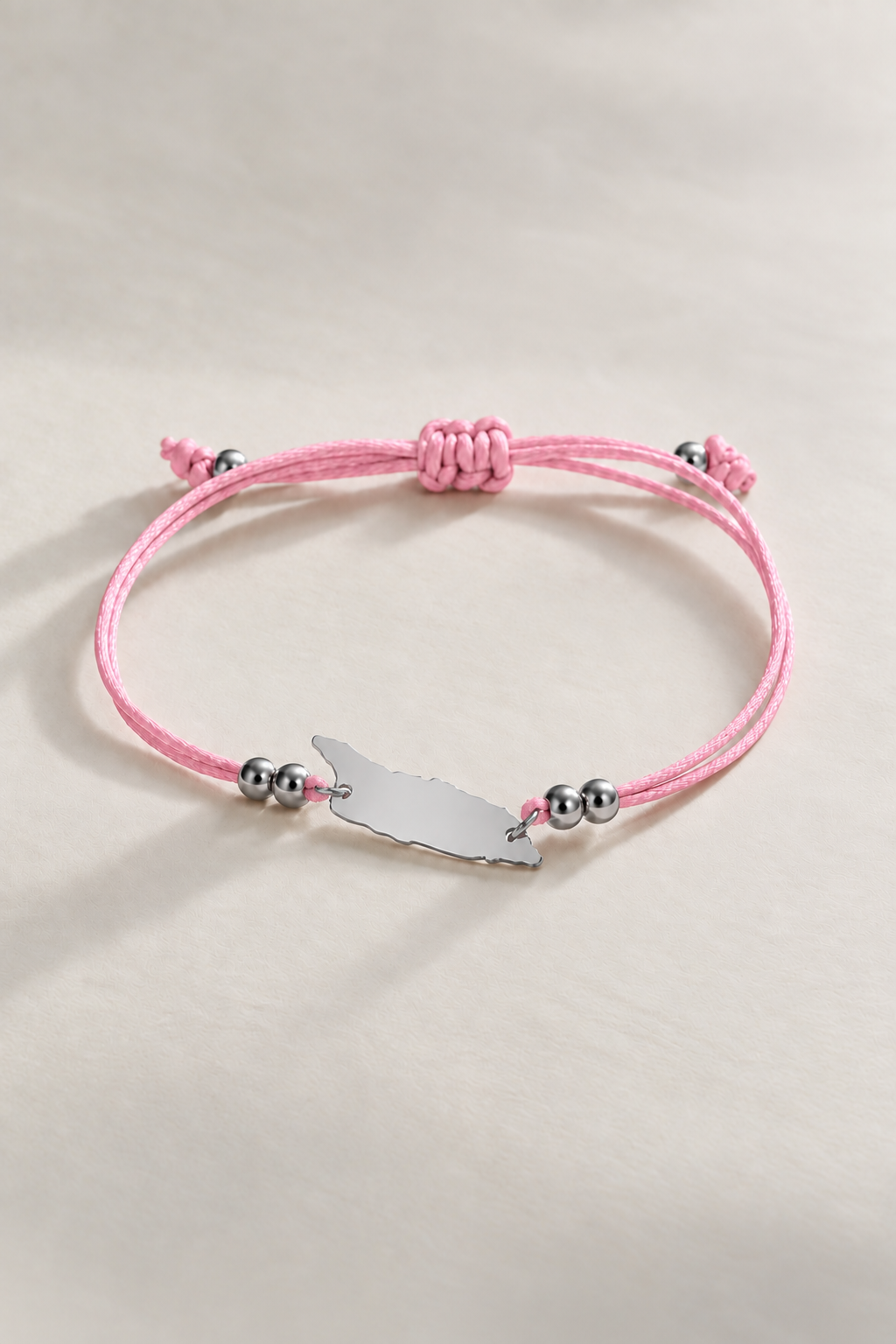 Baby pink Aruba cord bracelet with silver-tone details