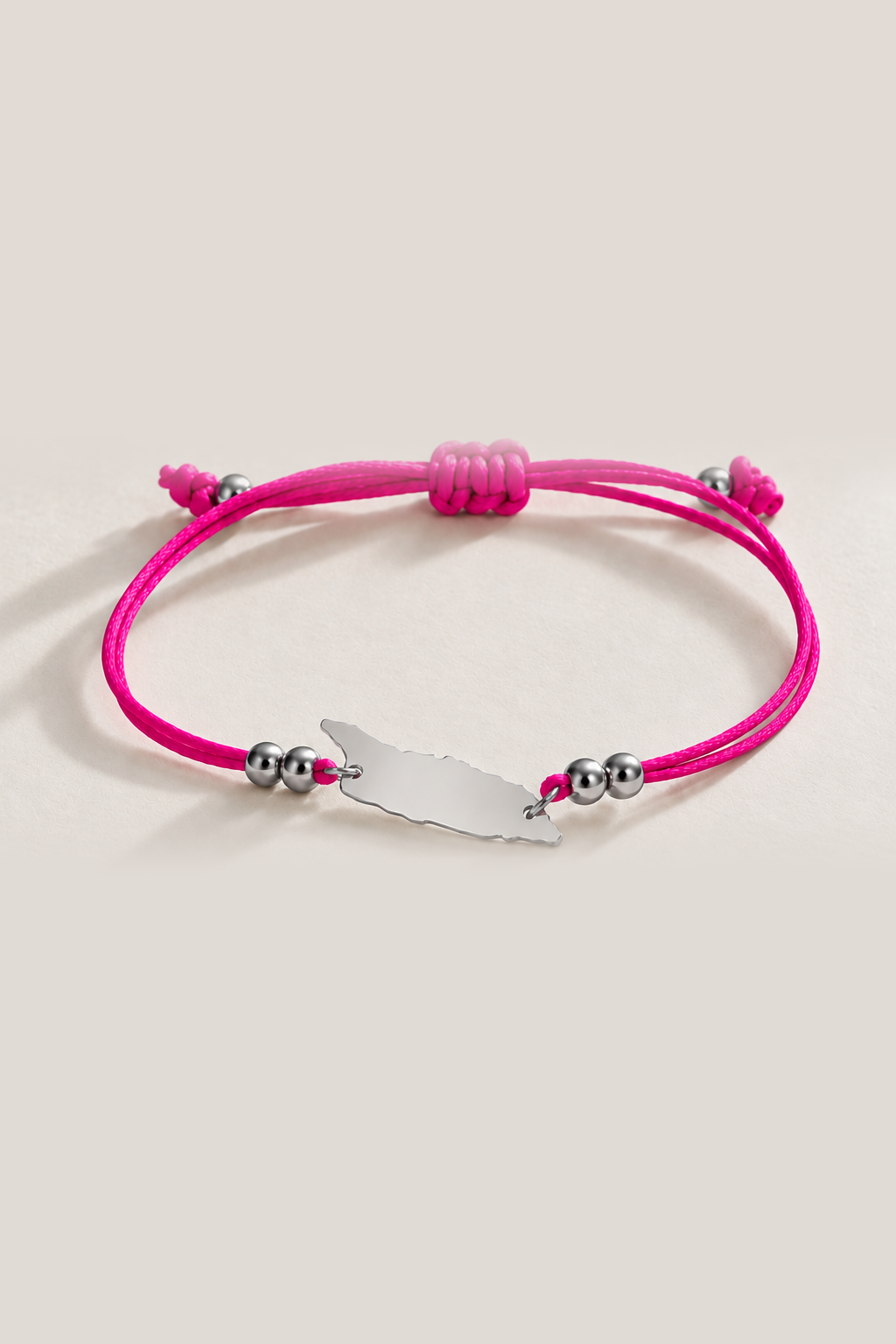 Fuchsia Aruba cord bracelet with silver-tone details