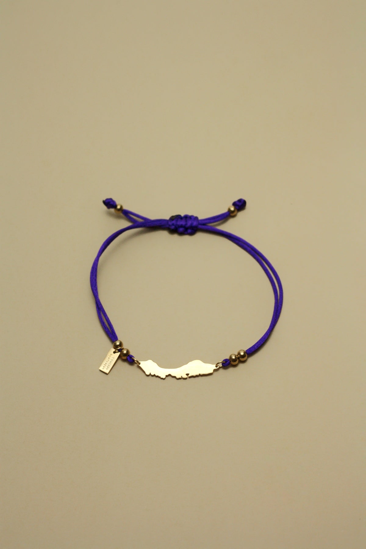 Curaçao island silhouette on amethyst purple cord bracelet