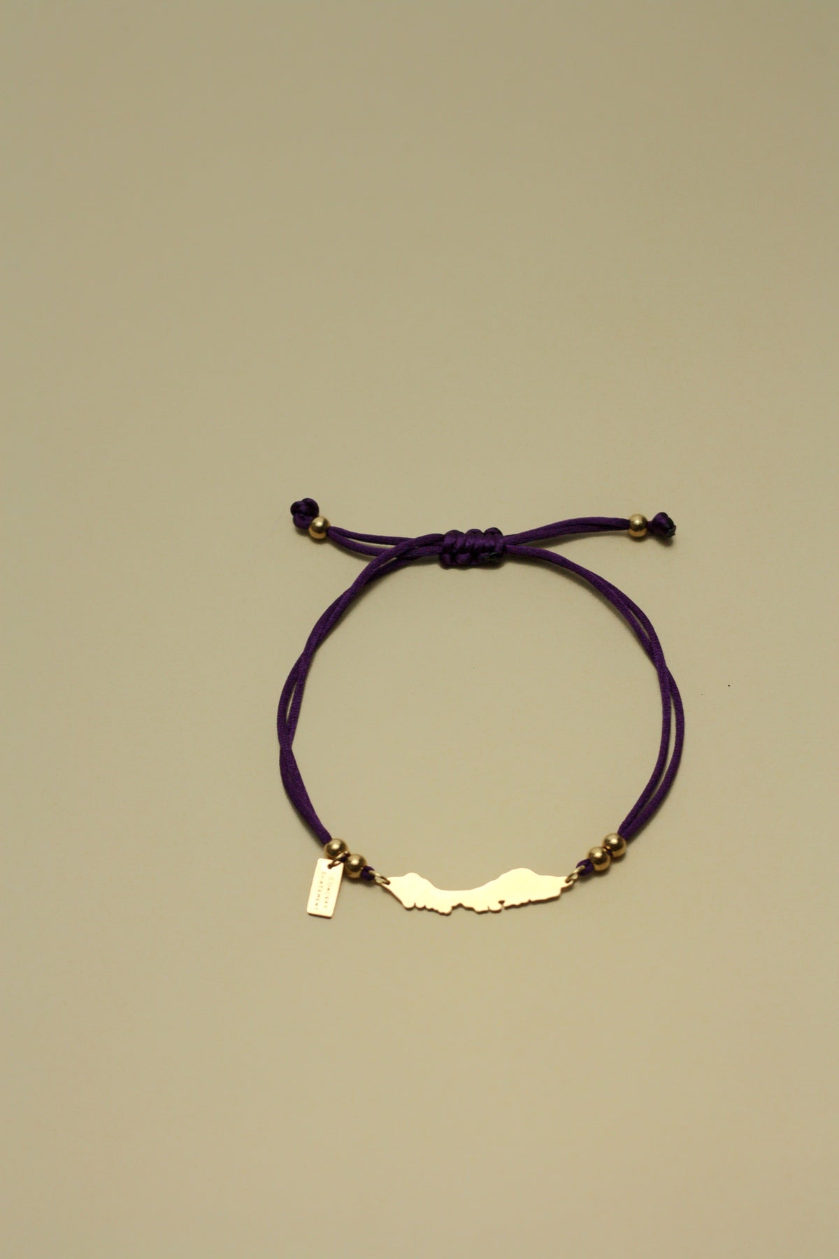 Curaçao cord bracelet in eggplant purple