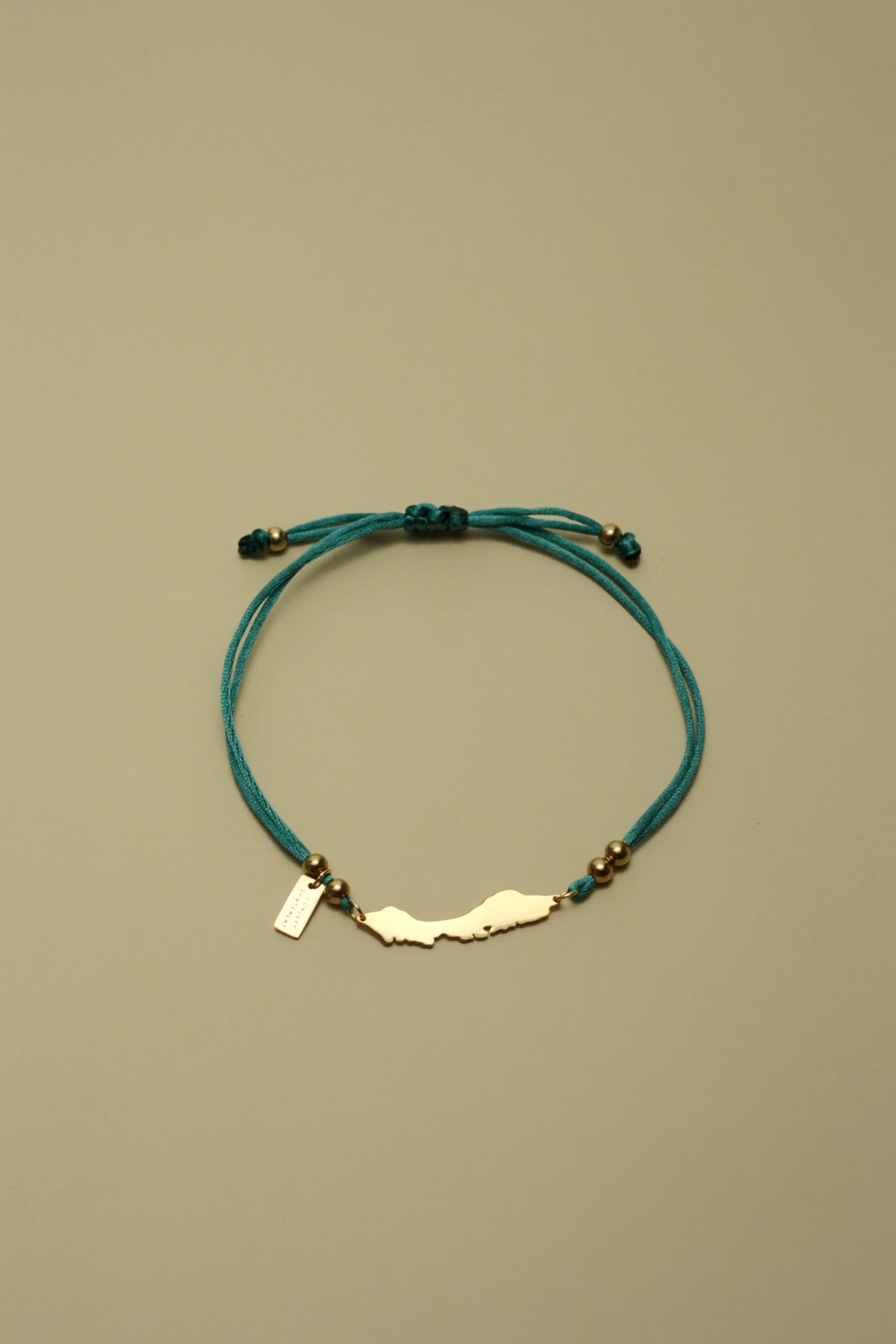 Curaçao island bracelet on sea green cord