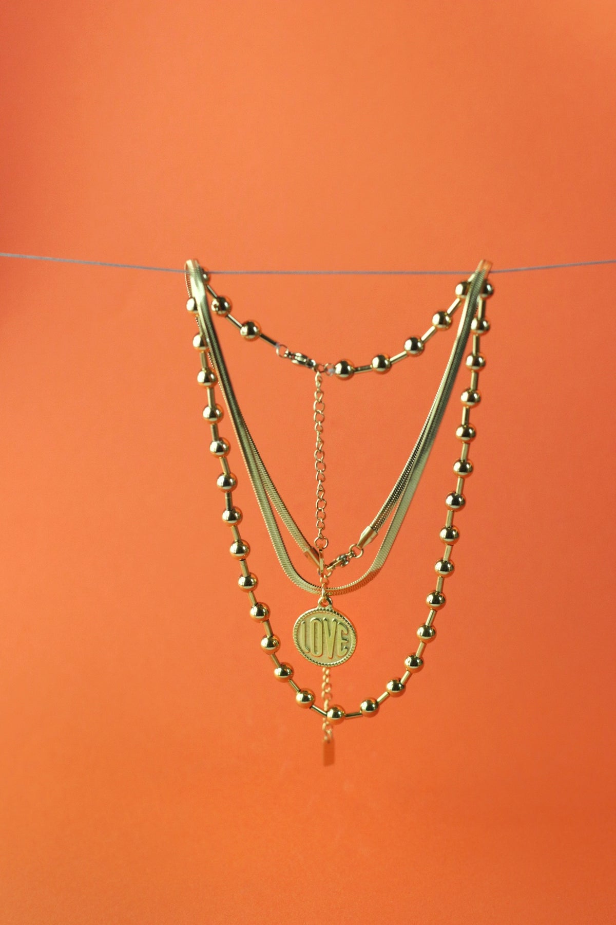Love Coin Necklace with engraved love pendant and snake chain by Concept Statement