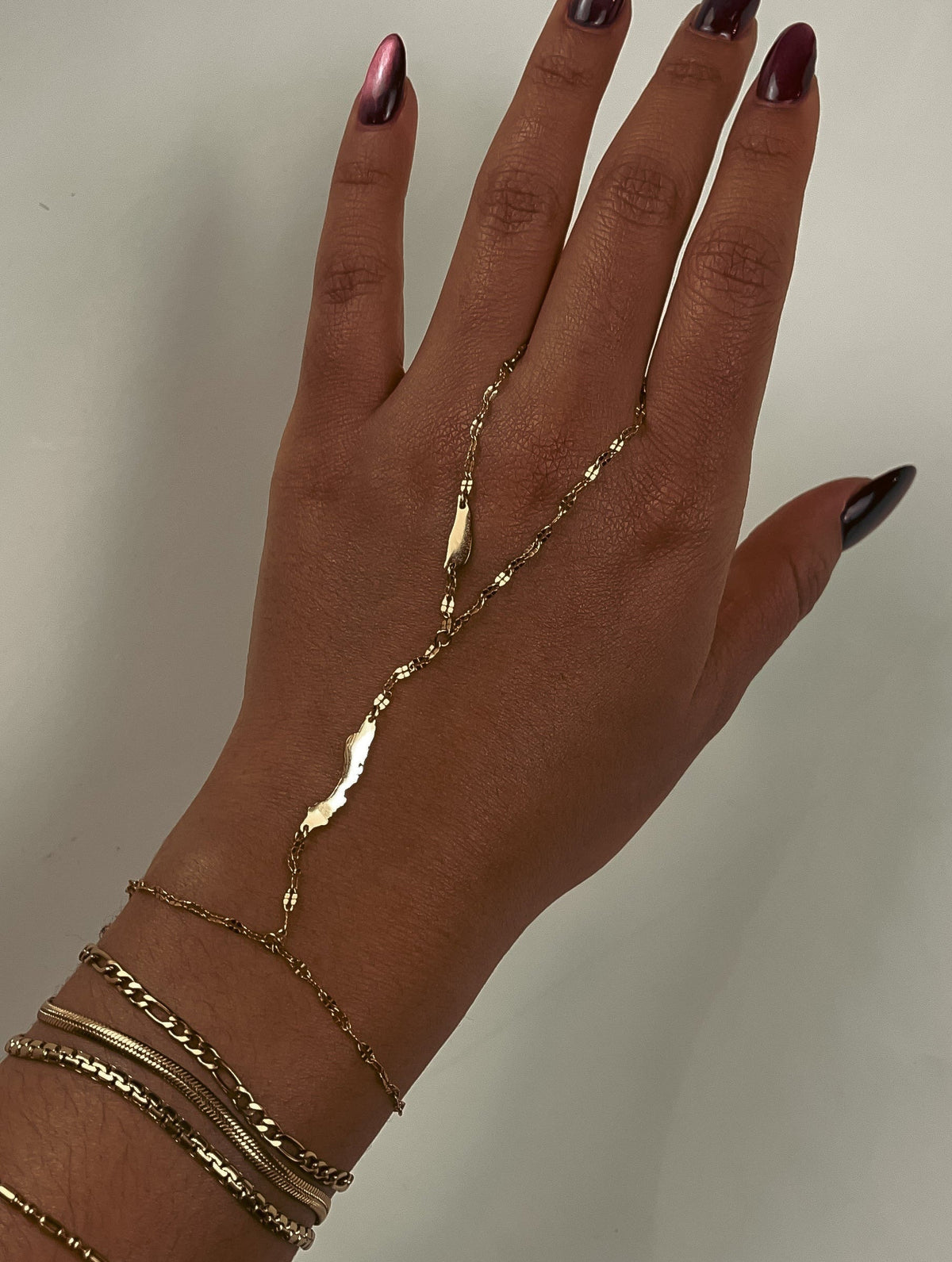 Concept Statement OG Curaçao Hand Chain featuring Curaçao and Klein Curaçao island silhouettes