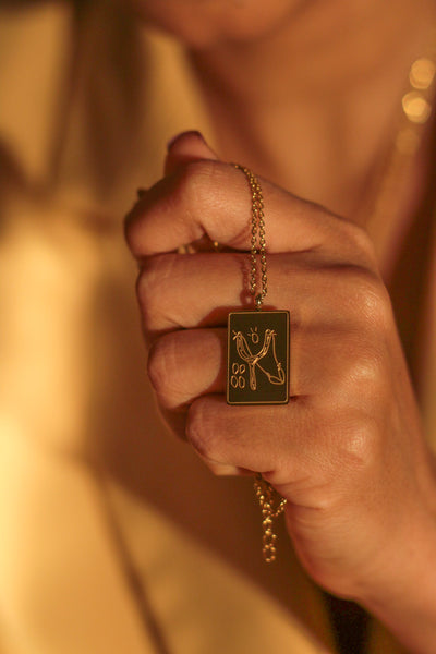 David slays Goliath, slingshot necklace