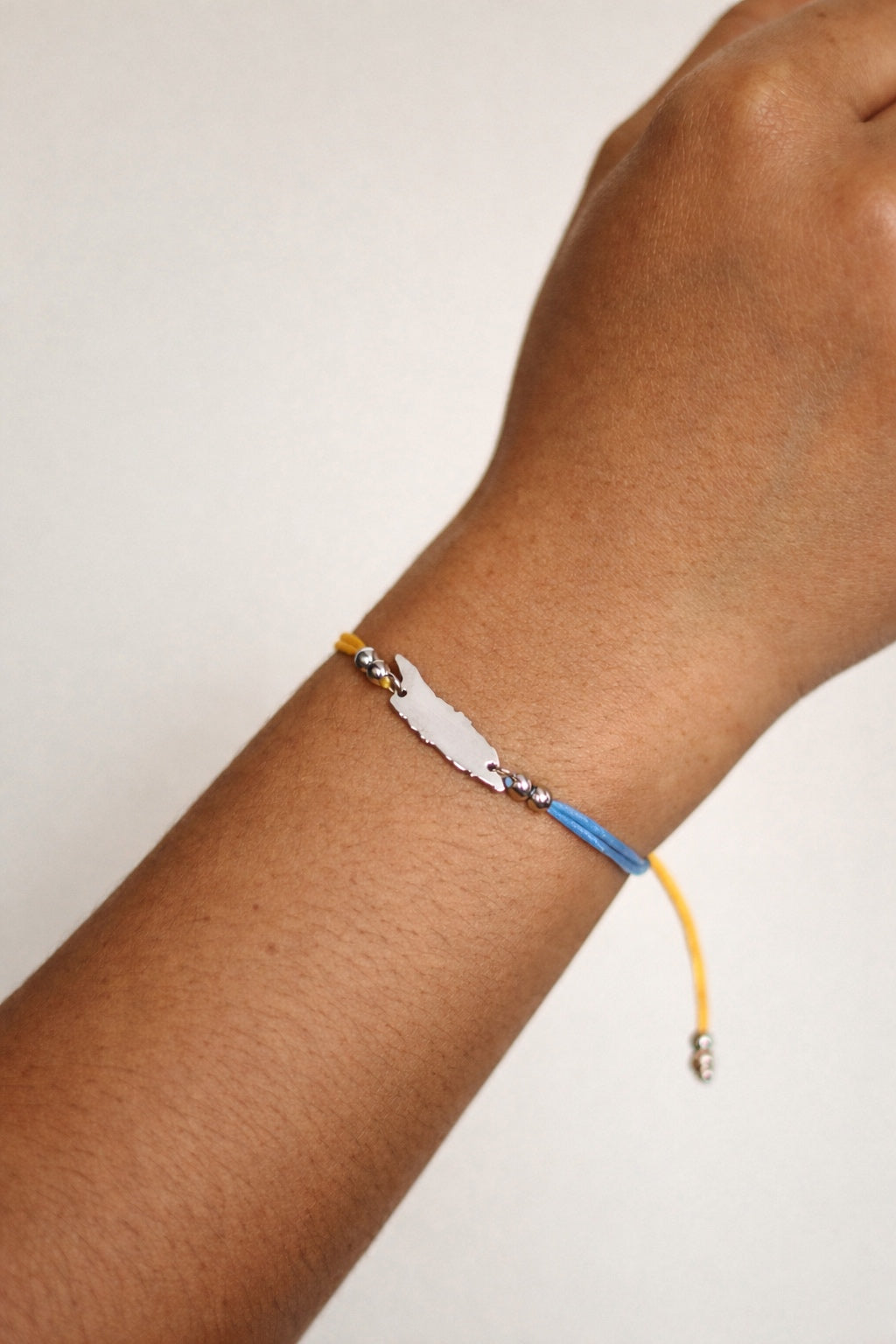 Silver-tone Aruba island cord bracelet in flag colours