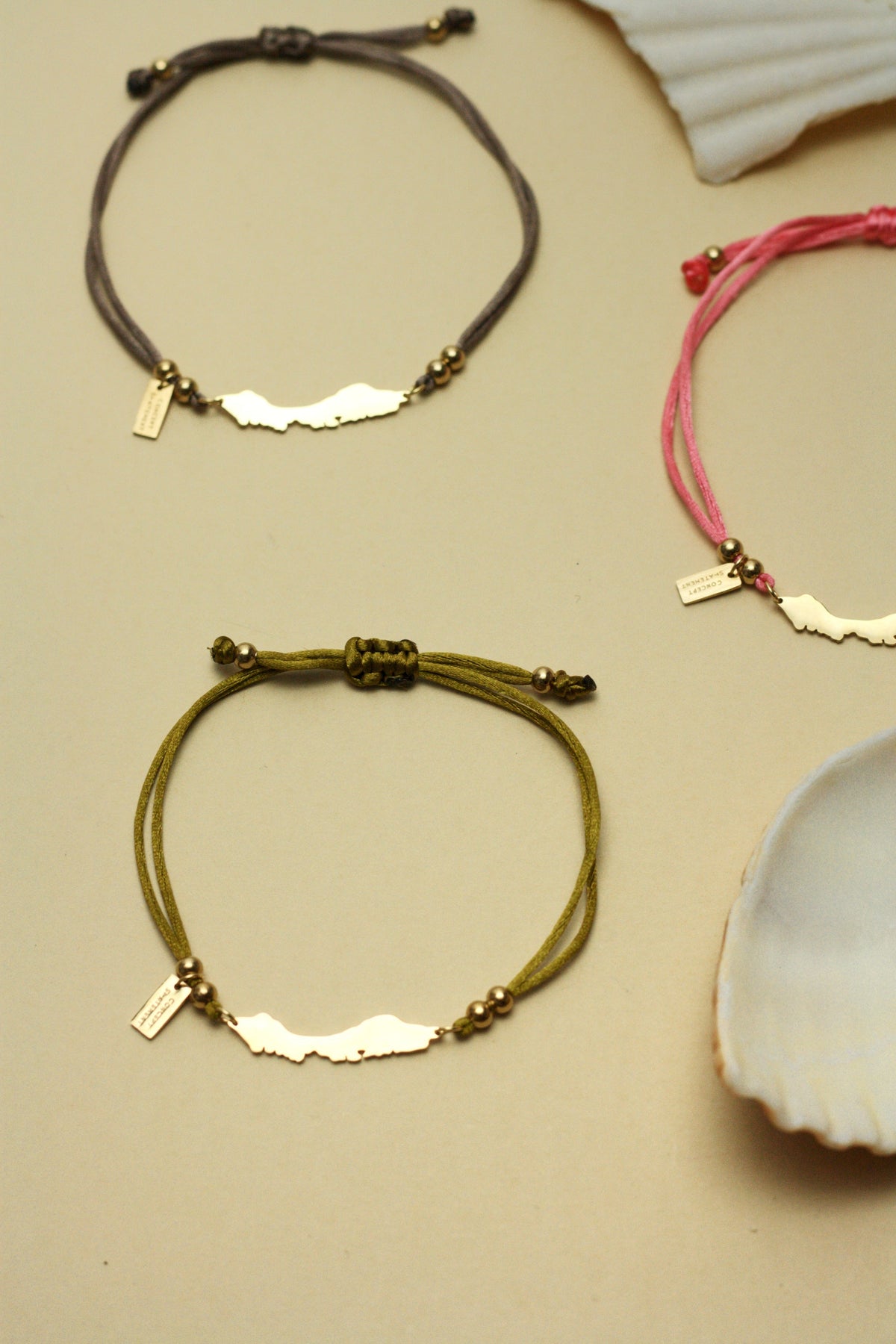Curaçao island bracelet on bright olive green cord
