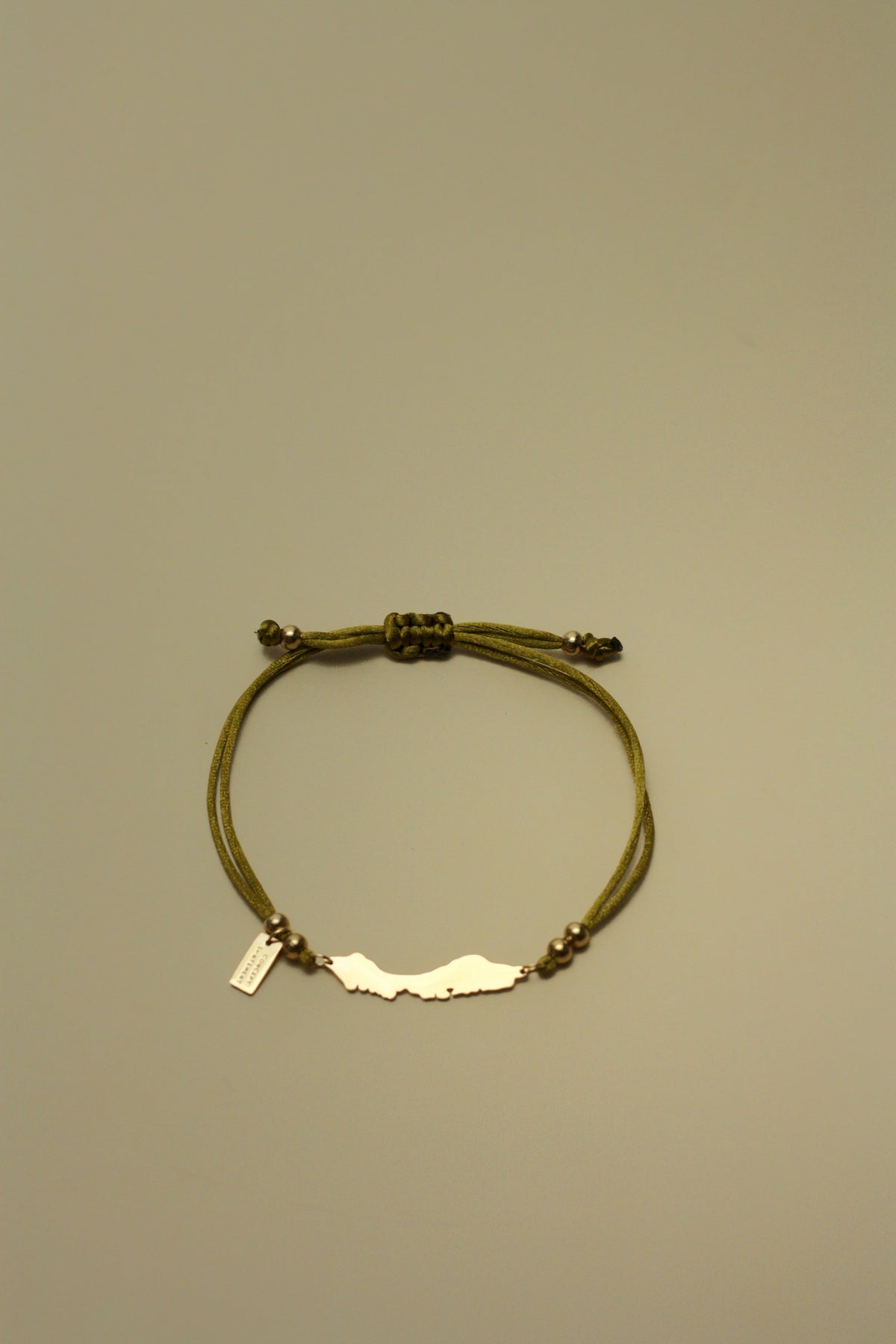 Curaçao cord bracelet in bright olive green