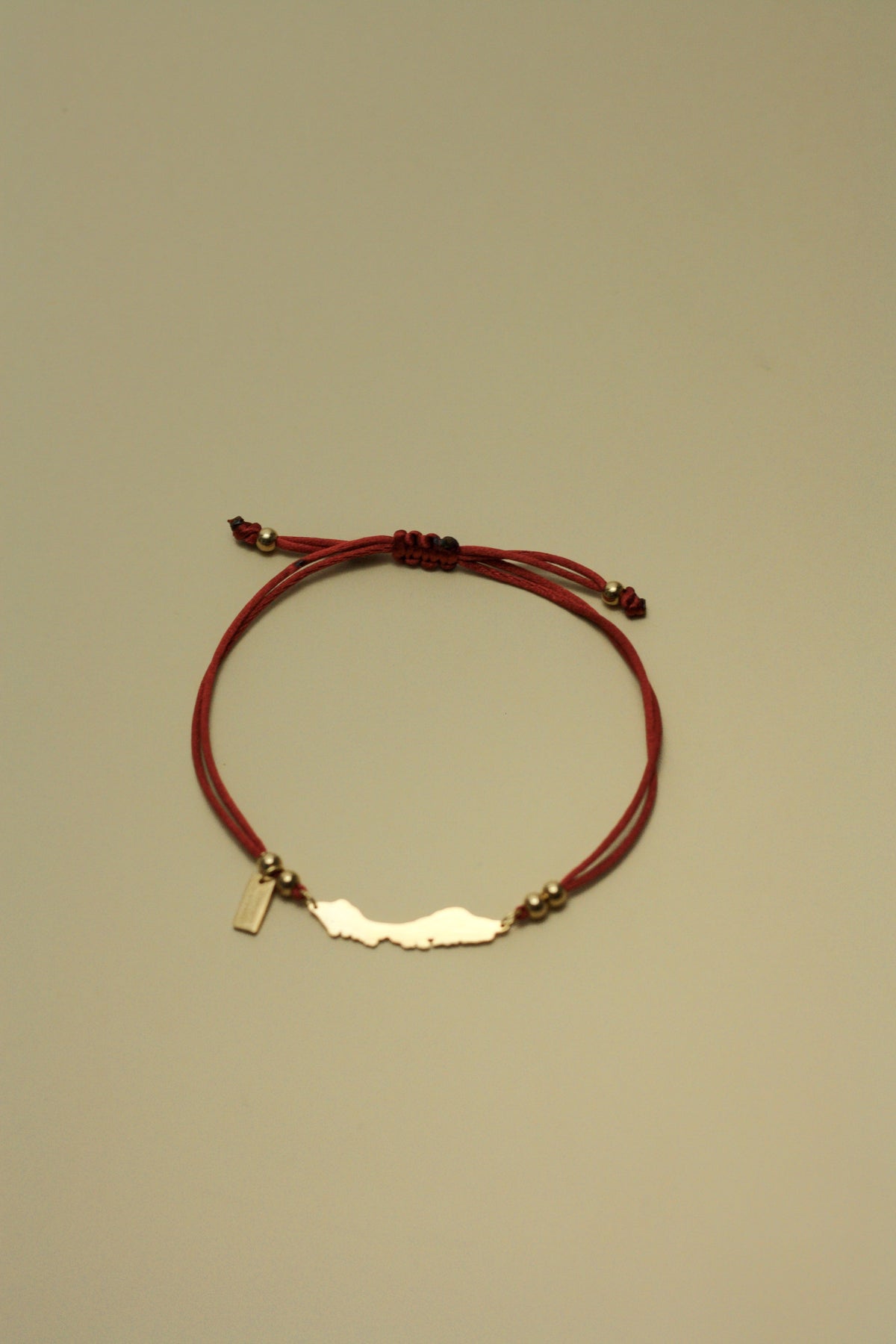 Curaçao island bracelet on copper brown cord