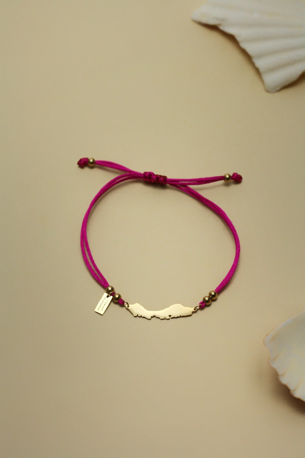 Curaçao cord bracelet in fuchsia