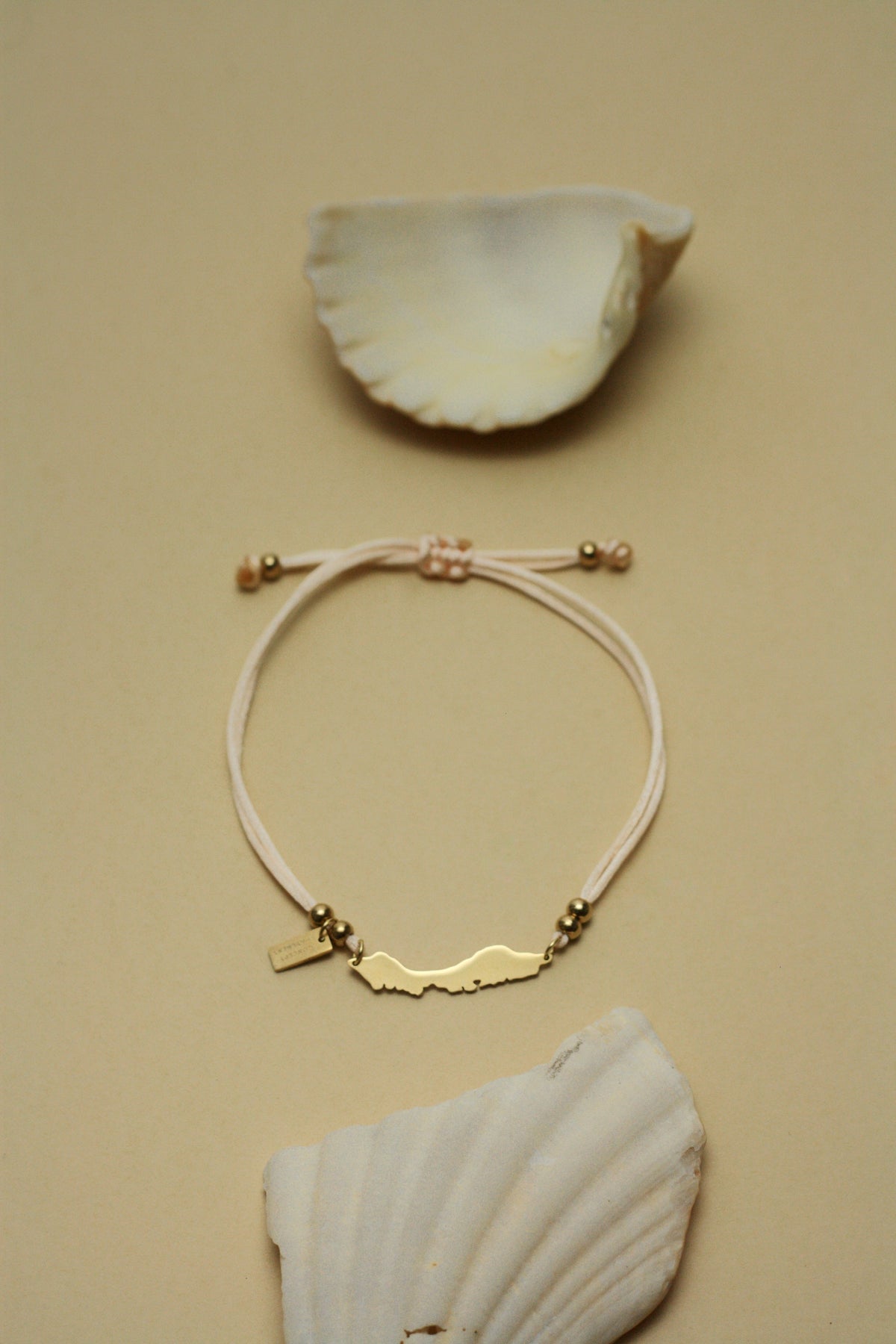 Curaçao island bracelet on nude pink cord