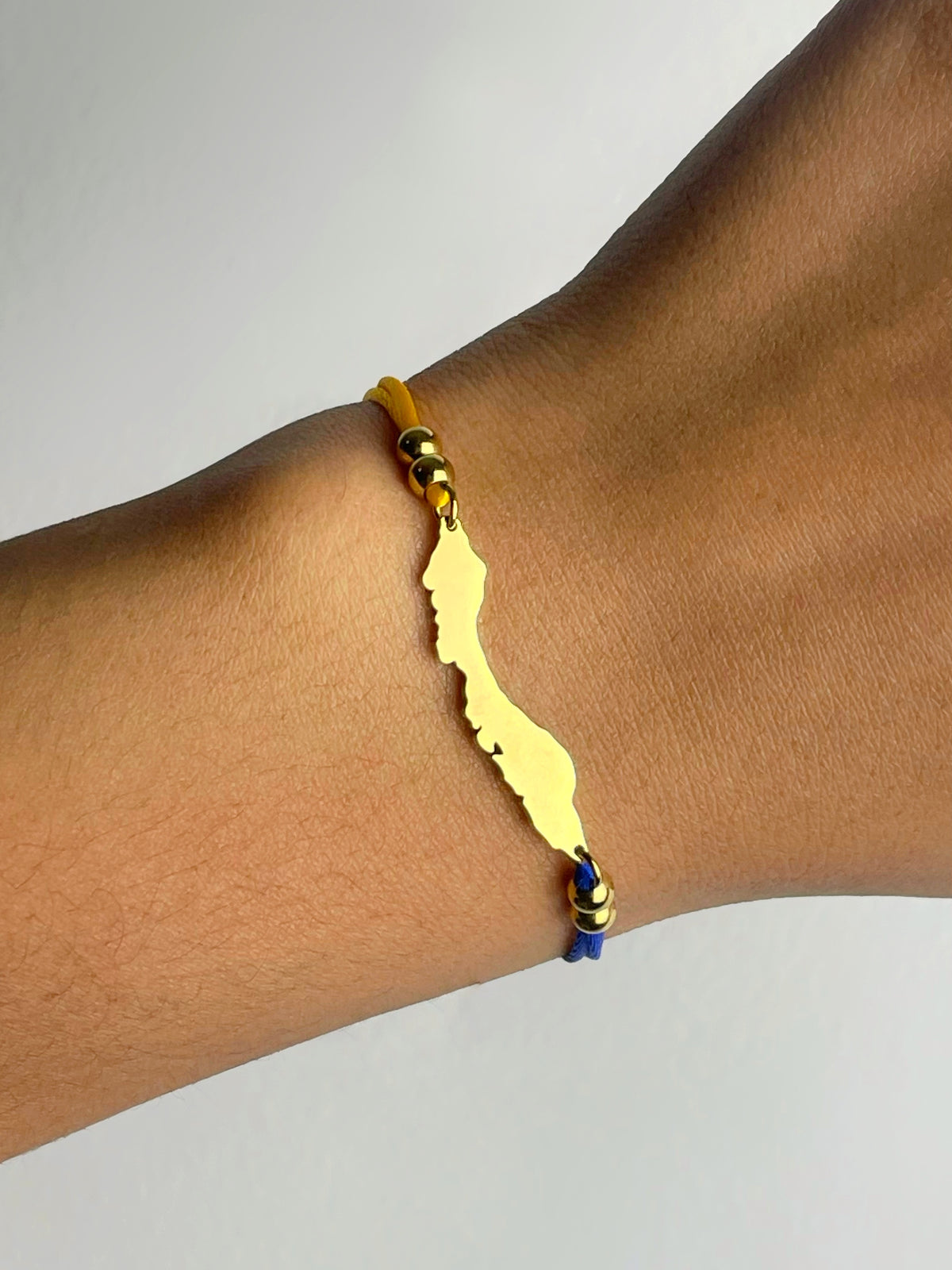 Curaçao flag-colour cord bracelet by Concept Statement
