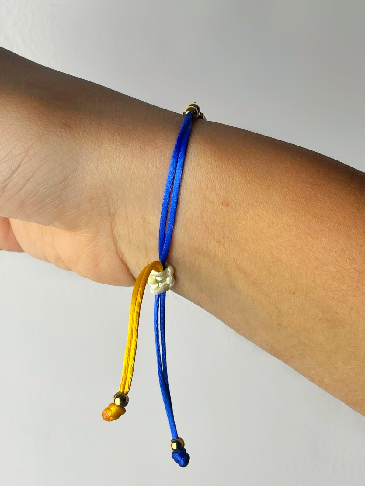 Curaçao flag-colour cord bracelet with island silhouette
