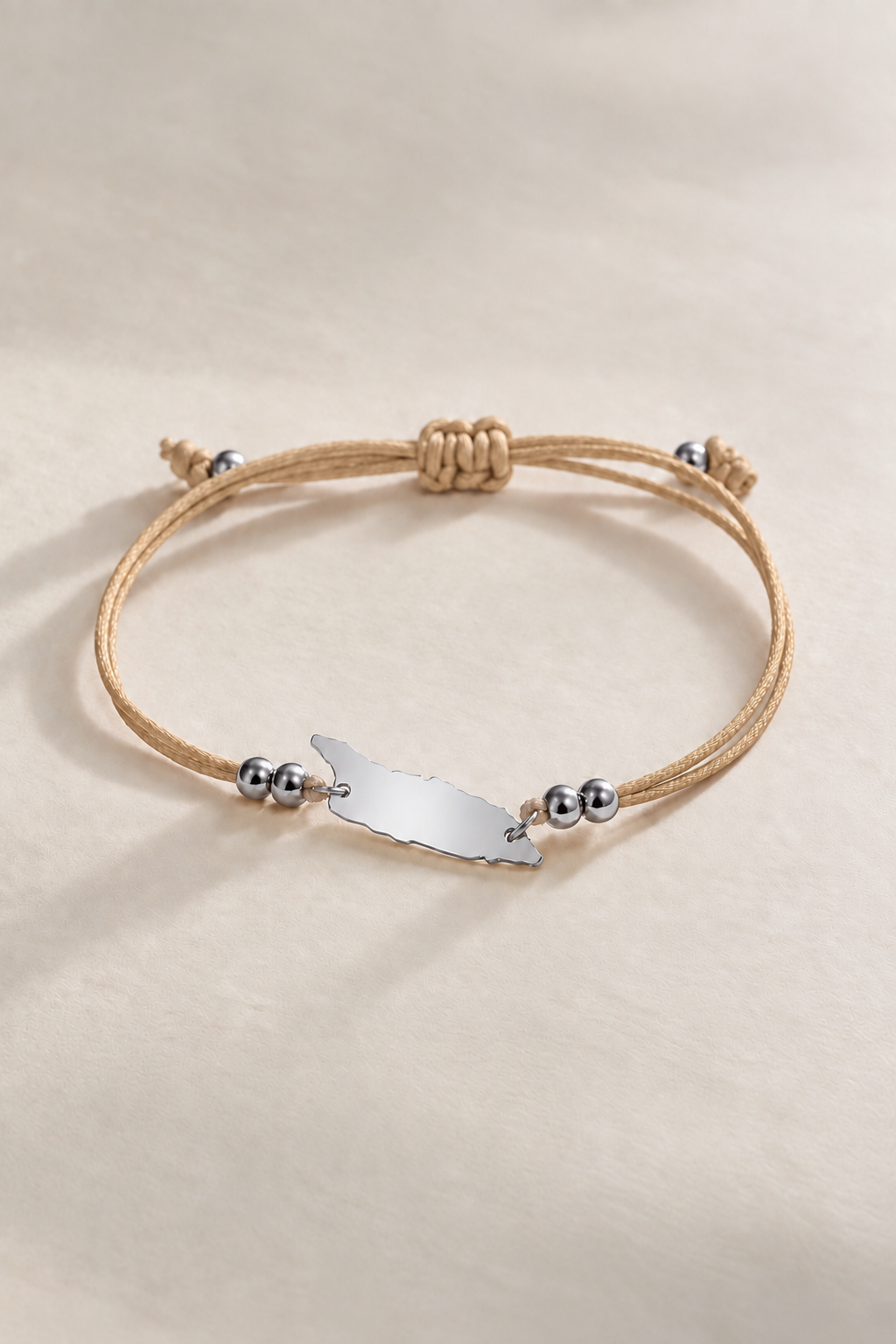 Sandy-coloured Aruba cord bracelet with silver-tone accents