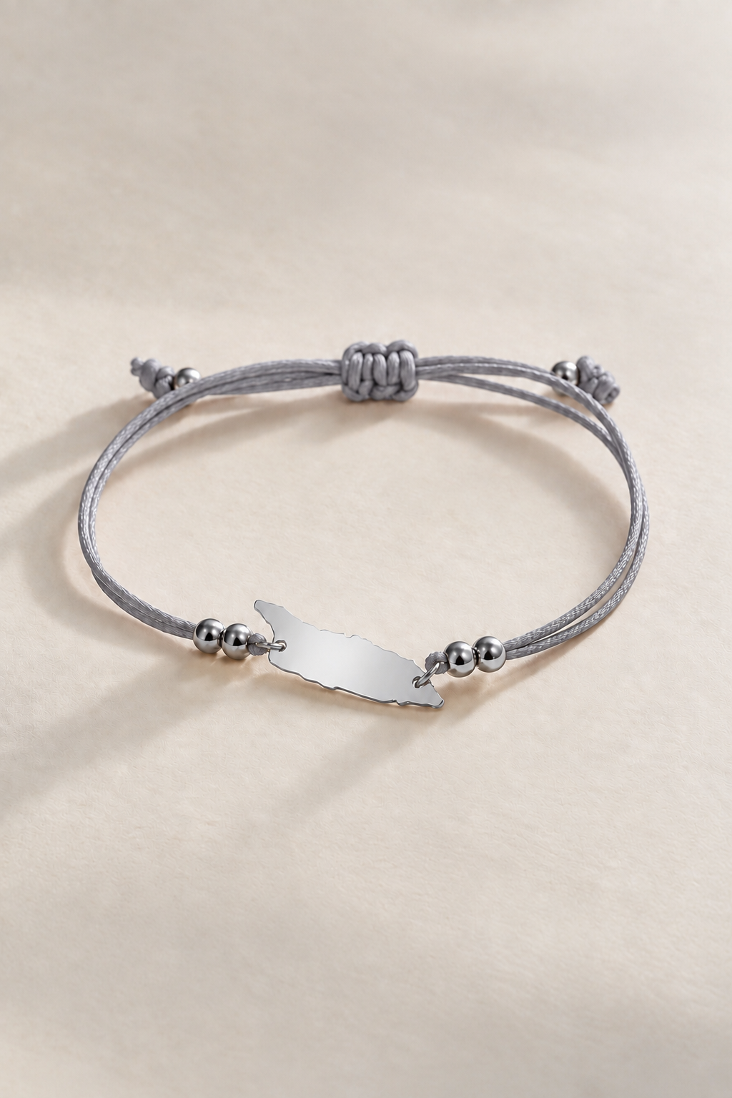Silver-tone details on Aruba island cord bracelet