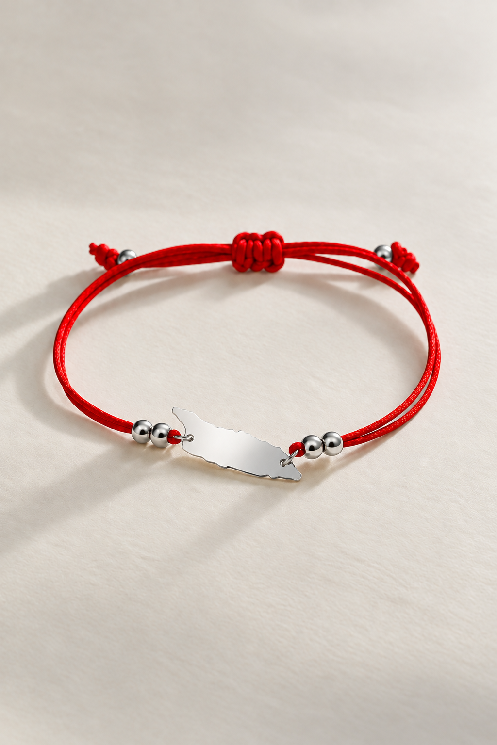 Red Aruba cord bracelet with silver-tone details