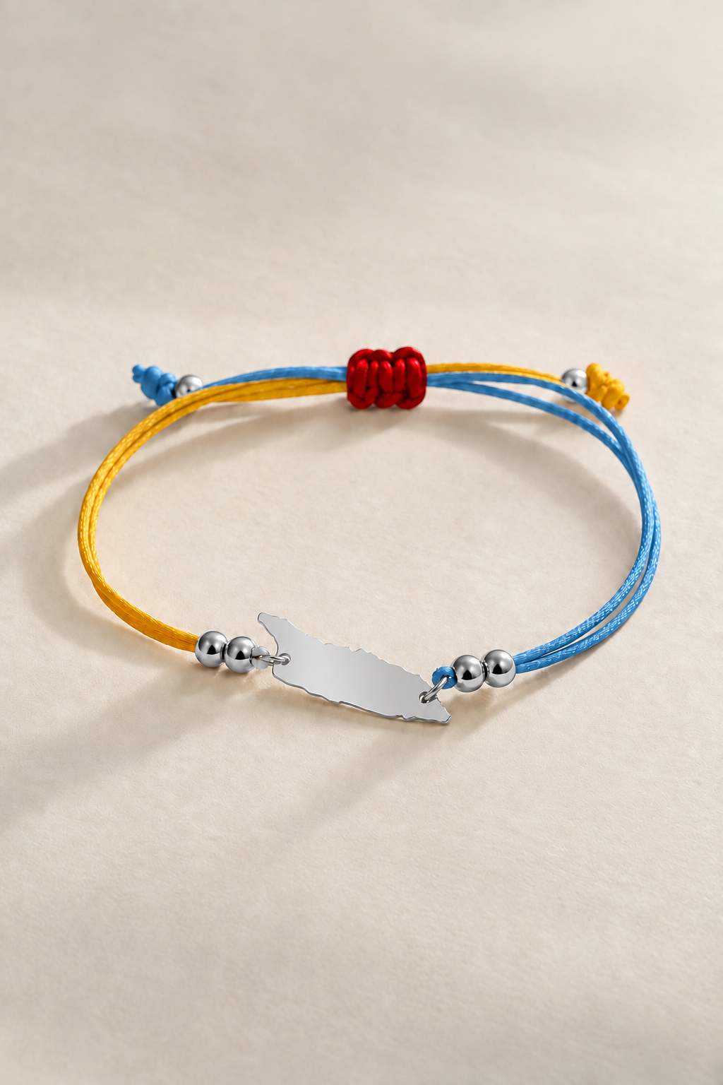 Silver-tone Aruba flag-colour cord bracelet