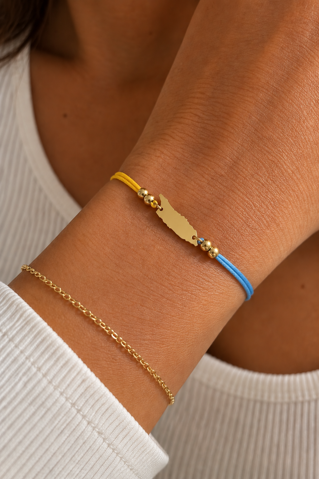 Aruba flag-colour cord bracelet styled for wearing