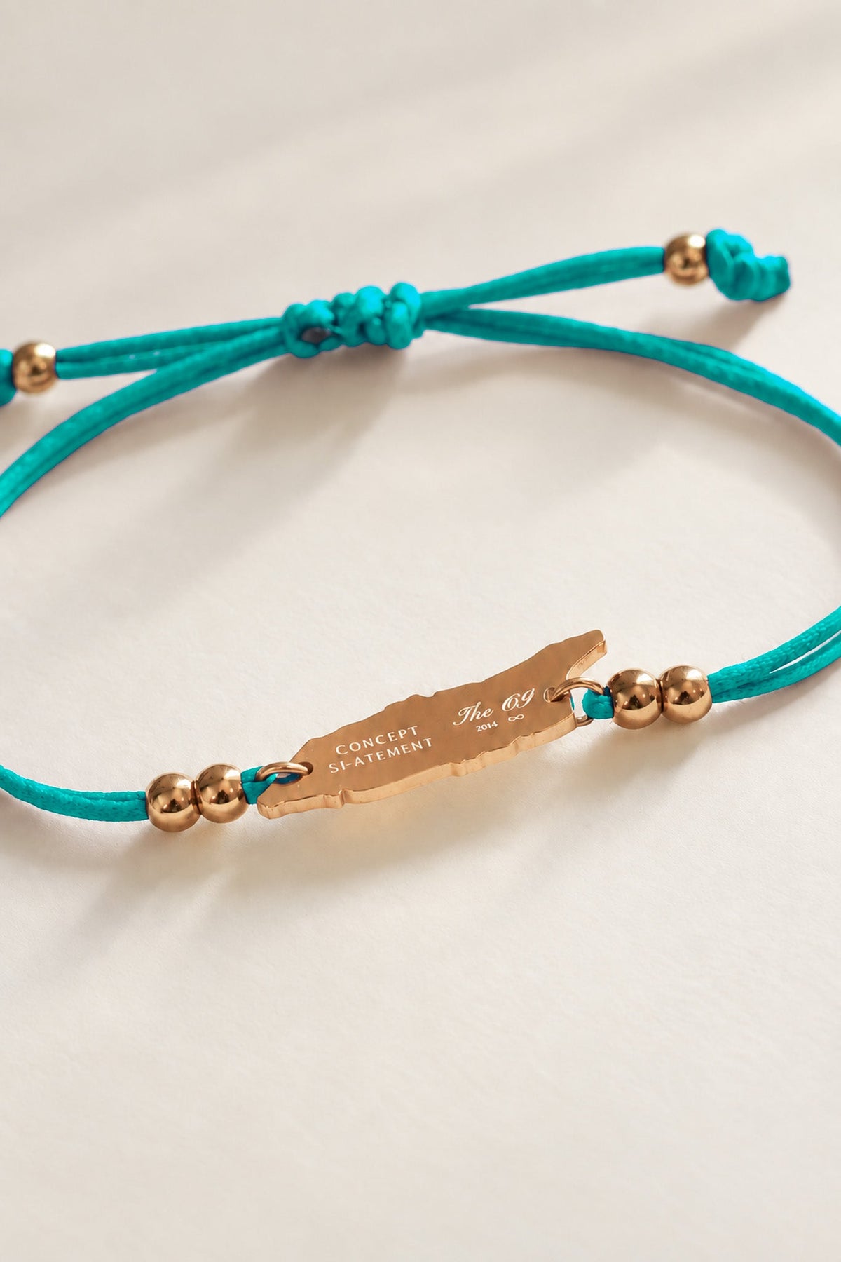 Sea green satin cord bracelet with Aruba island charm