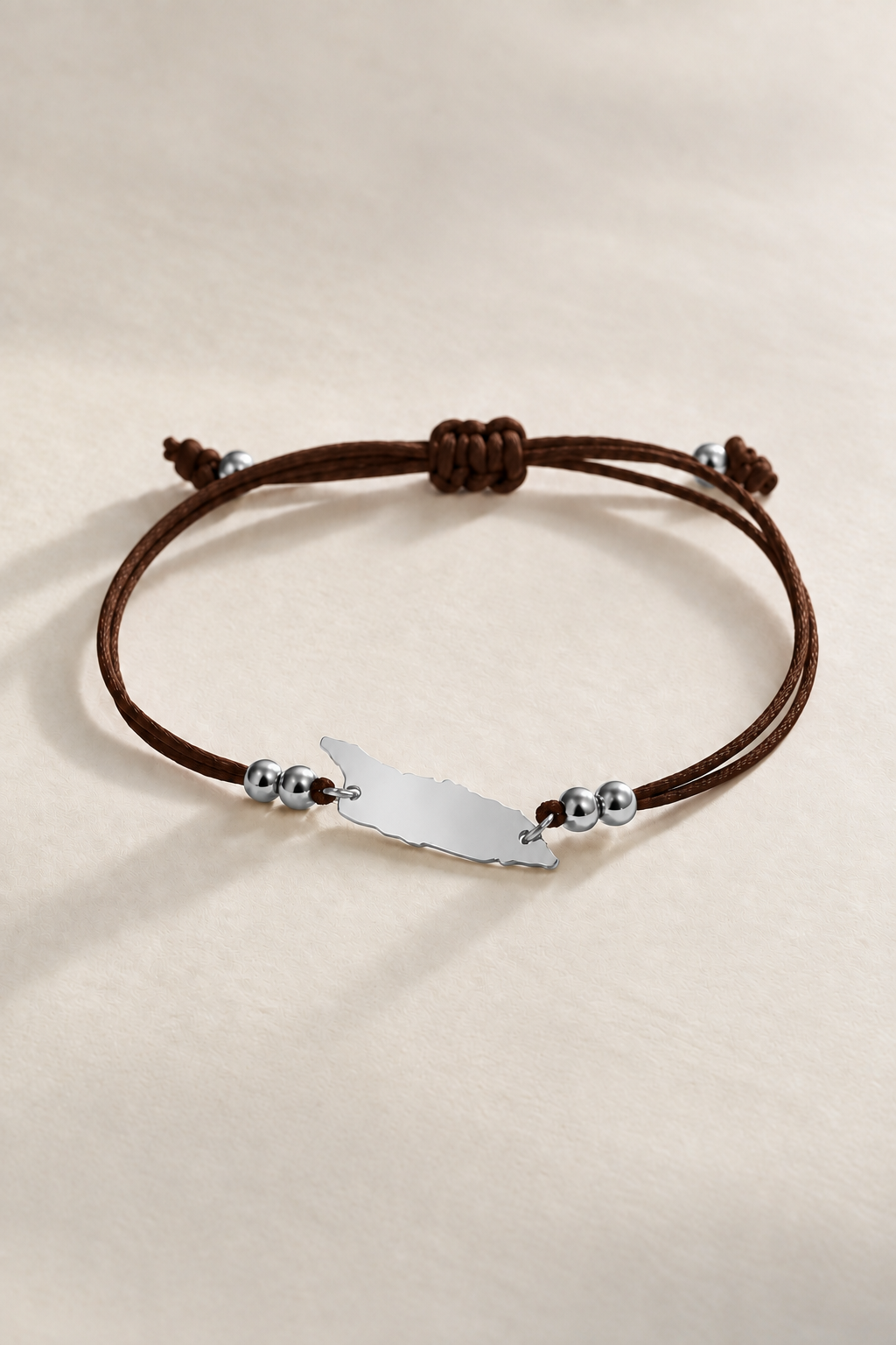 Dark brown Aruba cord bracelet with silver-tone metal details