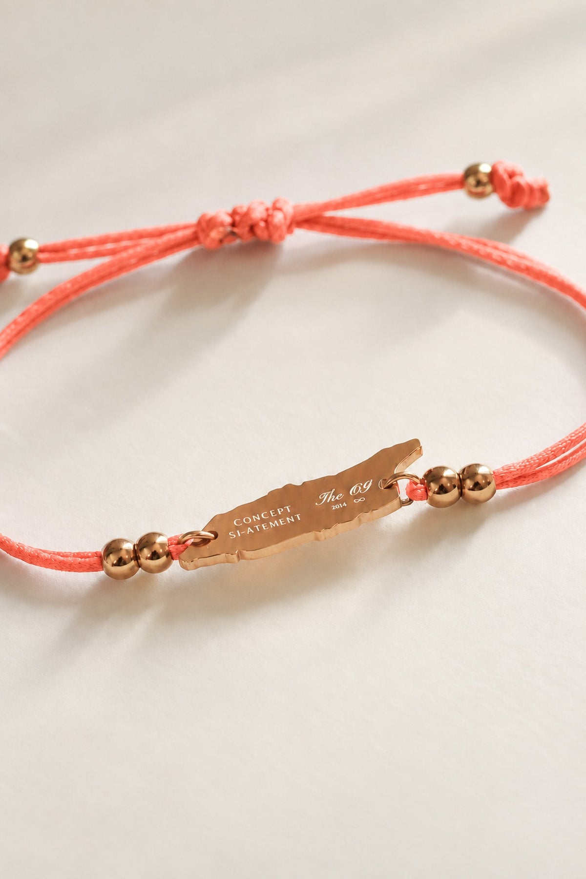Close-up of flamingo pink Aruba cord bracelet