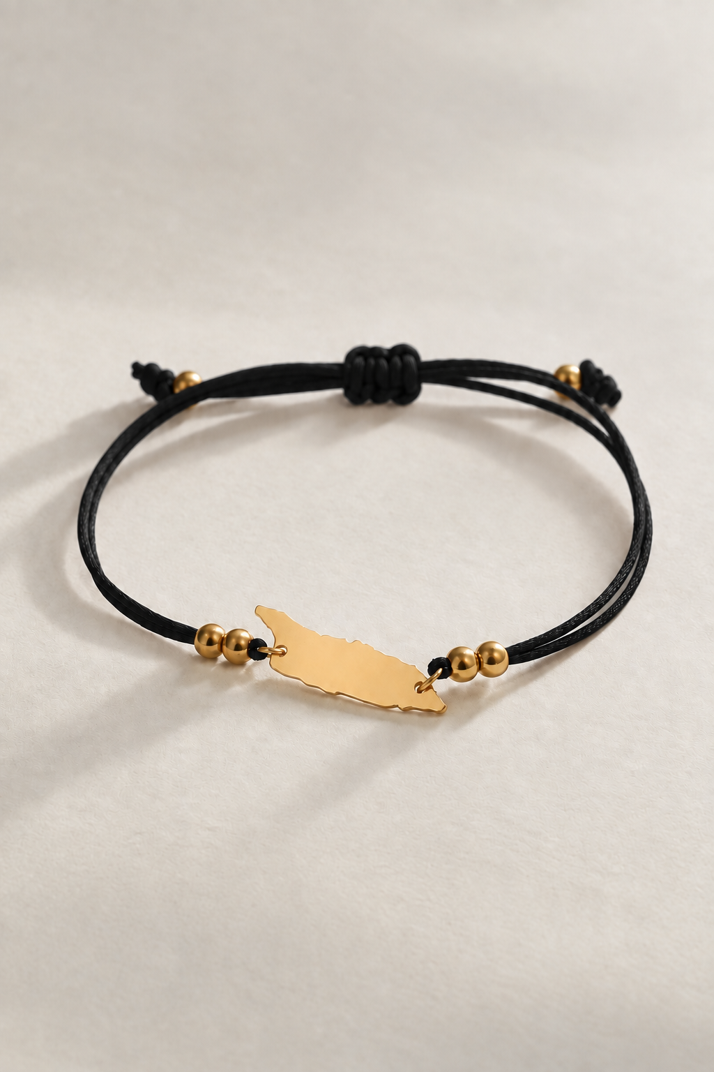 Black satin cord bracelet with Aruba island charm