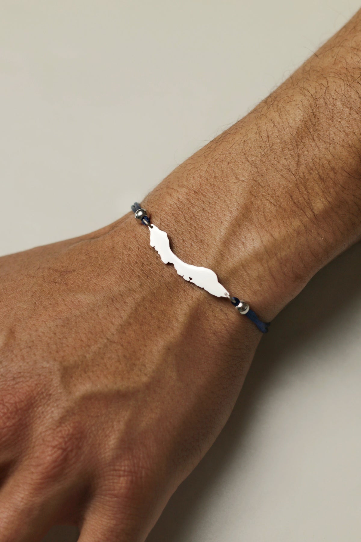 Dark blue adjustable cord bracelet with Curaçao island silhouette for men