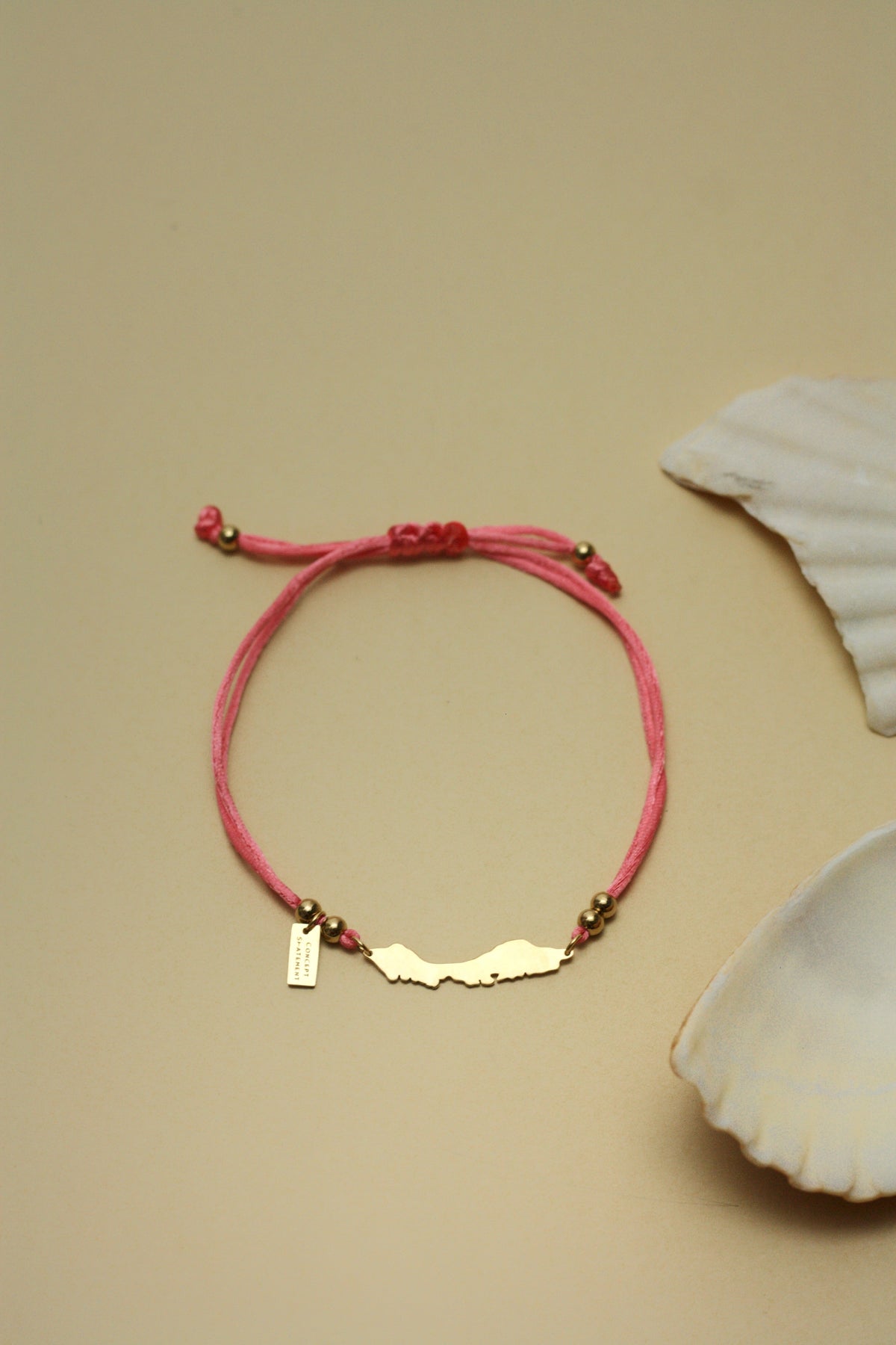 Curaçao island bracelet on flamingo pink cord