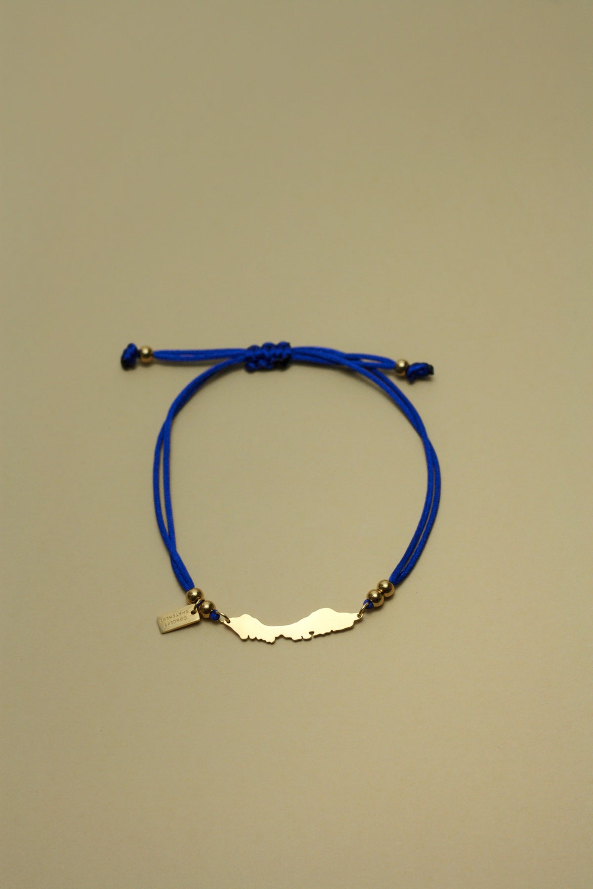 Royal blue cord bracelet with Curaçao island silhouette
